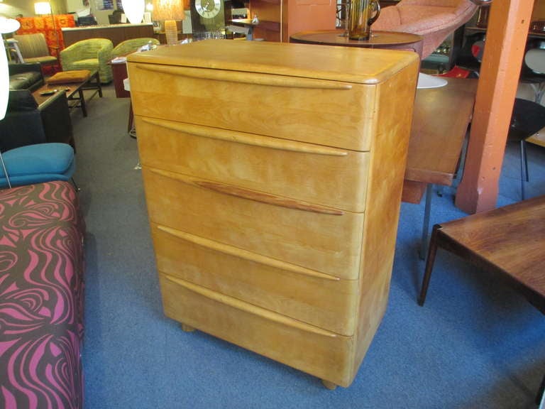 Wakefield highboy dresser of solid maple with five drawers with eyebrow pulls.