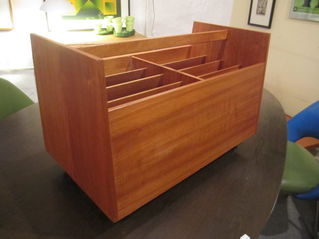 Large rolling teak magazine rack with all lables still attached even the inspection sticker