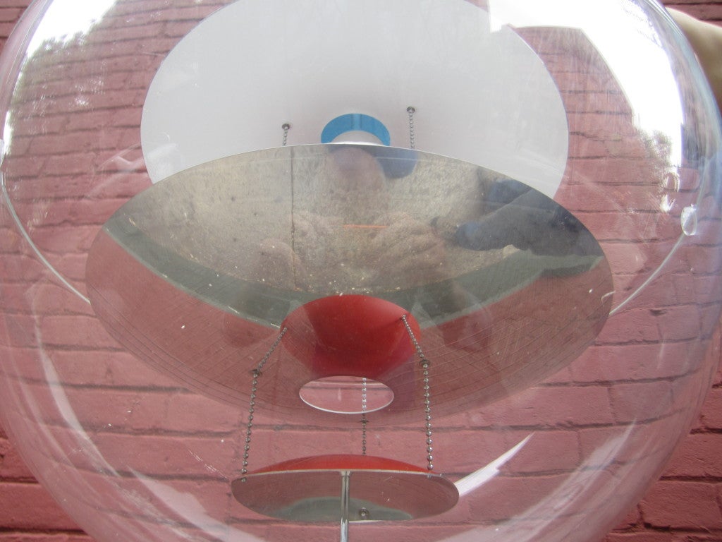 Panton's iconic Globe desigined in 1975.  This is a seventies production of the lamp and is the larger of the two made.  Creates a spectactular glow when lit with orange/red and blue internal discs magnified by polished metal reflectors.