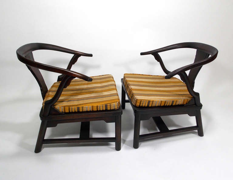 A diminutive pair of lounge chairs in the Asian Modern aesthetic.