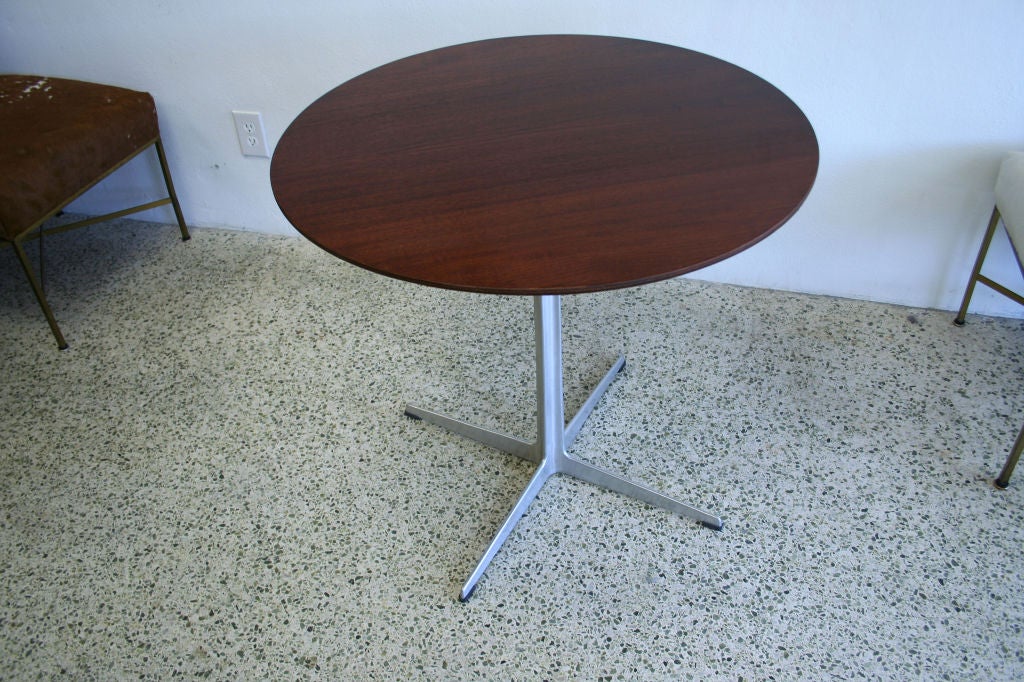 Arne Jacobsen Cafe Table, manufactured by Fritz Hansen

Aluminum  and Teak

Label below
