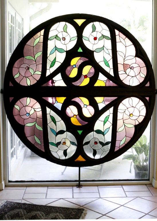 Beautiful Antique Stained Glass Window comprised of two demilune portions which can be used separately or together.