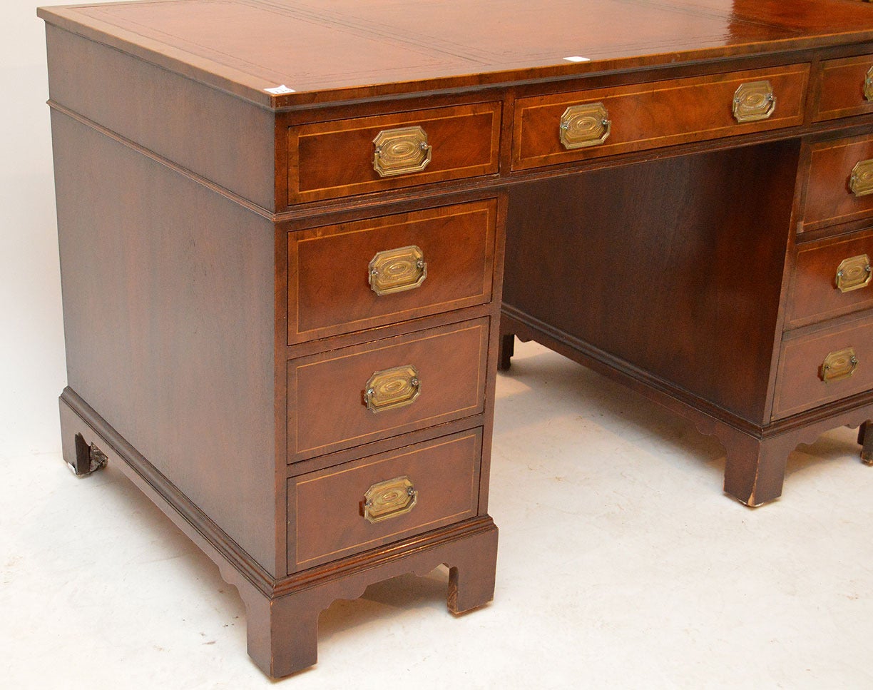 Servers, chairs, bookcases, cabinets, tables. 
 

 This is a superb quality mahogany double pedestal writing desk with the original brown leather to the top, made by Baker, USA.
It sits on Georgian style bracket feet the drawer linings are solid