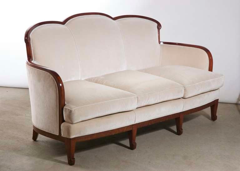 French Art Deco sofa by Sue et Mare, ca. 1920 in French walnut.
