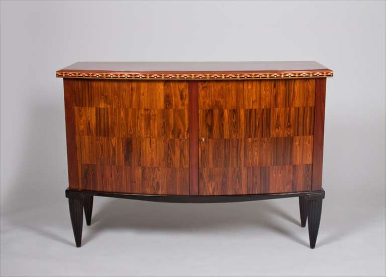 This cabinet, in purple heart and kingwood, with marquetry in exotic hardwoods and silvered metal, was presented at the second exposition of contemporary decorative art at the Pavilion Marson, at The Louvre, in Paris.