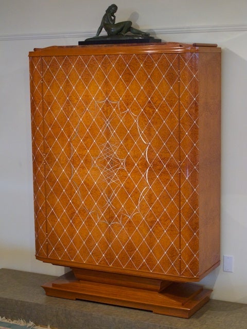 French 1940s cabinet by Pierre-Paul Montagnac. Model exhibited at the 1945 Salon d'Automne.

This cabinet is a masterpiece of French cabinet-making designed by Pierre-Paul Montagnac. The front is decorated in an intricate whiplash marquetry pattern.