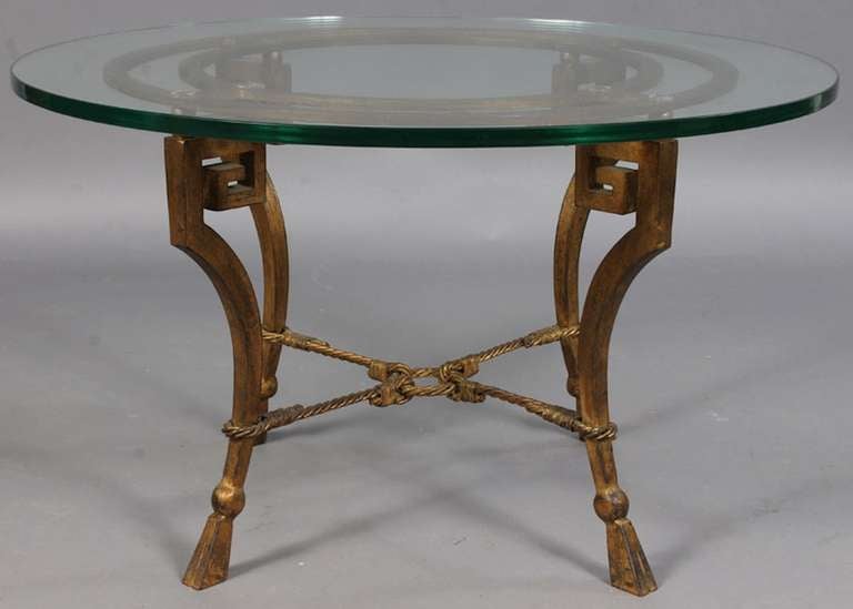 Ramsay table, circa 1945. Gilt forged iron with heavy glass top. Original gilding.