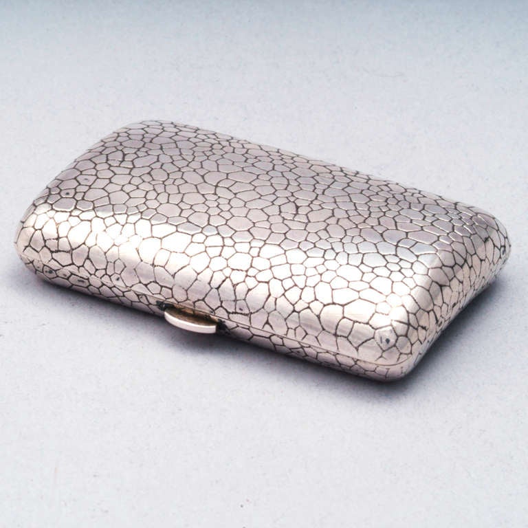 Silver cigarette case in embossed snakeskin pattern.  Hallmarked.