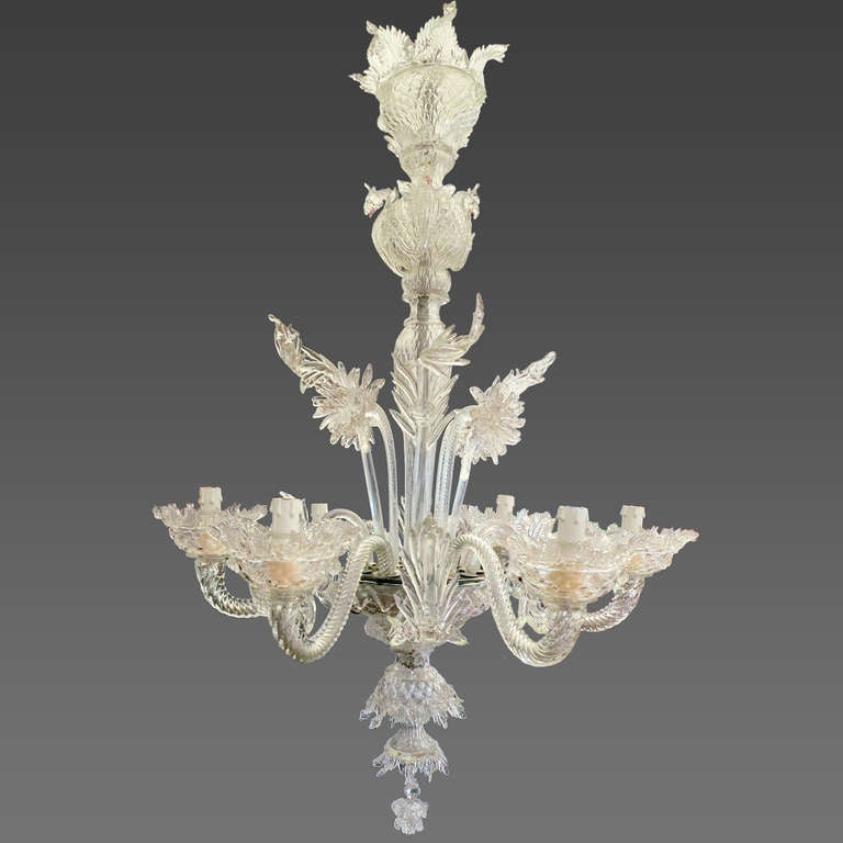 Significant Rezzonico style Murano glass chandelier by the famous Seguso glass making family. This glass master has perfected the art of the Murano chandeliers of the 18th century. This clear color glass six-light chandelier with twisted glass arms