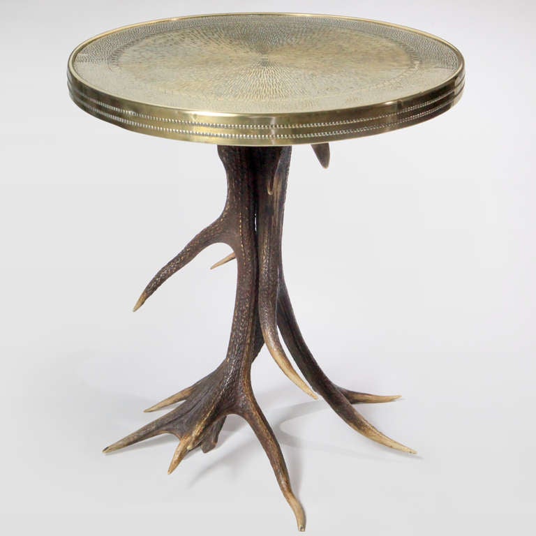 Vintage round side table with hammered brass top in a brilliant sunburst pattern with beaded brass banding.  All on Scottish red deer antler legs.