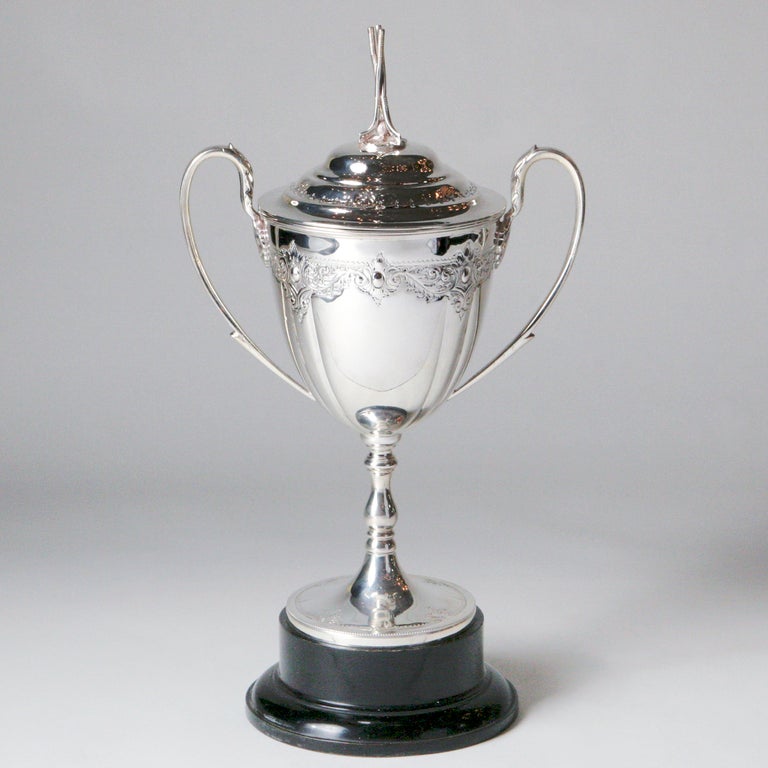 A silver plated urn-shaped golf trophy. Makers mark indicates Cooper Bros and Son, a popular silver plate company founded in Sheffield in 1866. This elegant piece is Edwardian in style and dates from around the beginning of the 20th century. It is