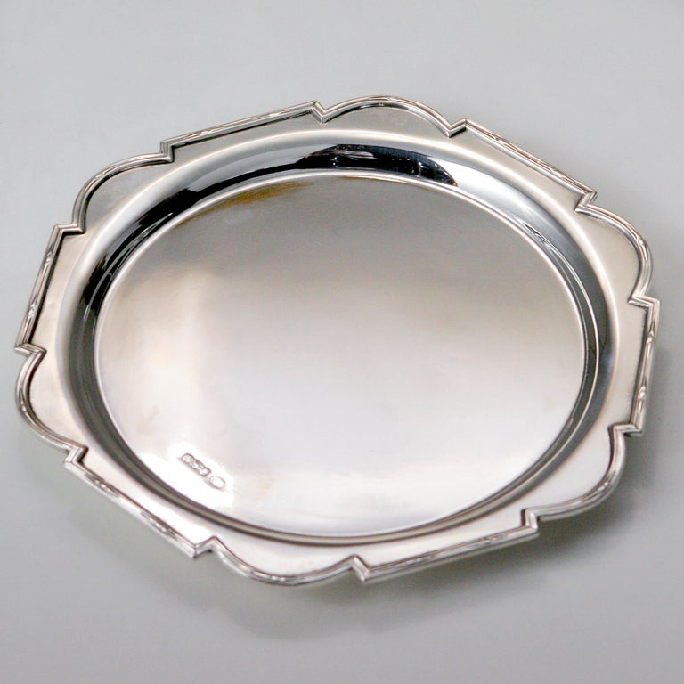 Sweet single server sterling silver tray.  Unusual scalloped edge ornamented with engraved diamond detailing.  Three button feet. Stamped: 