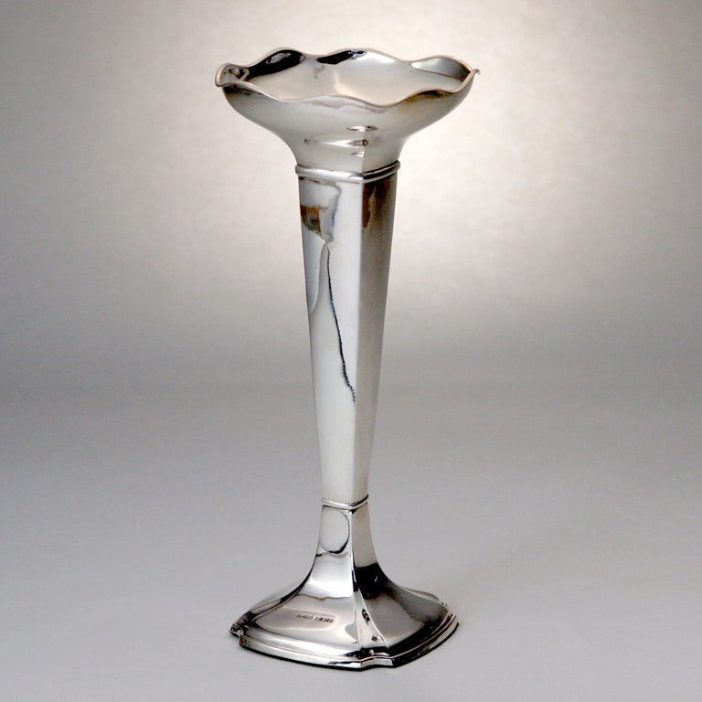 Sterling silver vase with tapered square center column and base.  This weighted vase is topped off by a square-shaped scalloped rim.  Hallmarked:  Sheffield 1925.  Maker's mark:  The Pinder Brothers.