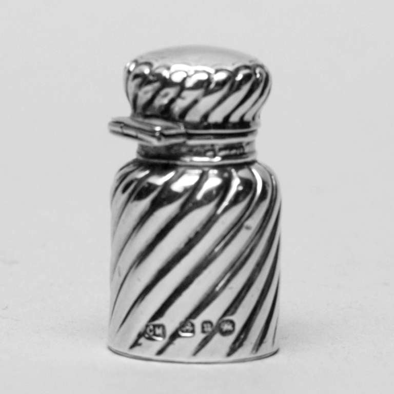 Handsome small sterling silver travel bottle in traditional twisted swirl pattern. Hallmarked: Birmingham, 1891. Can be used as a pill container. Smooth silver top perfect for monogramming.