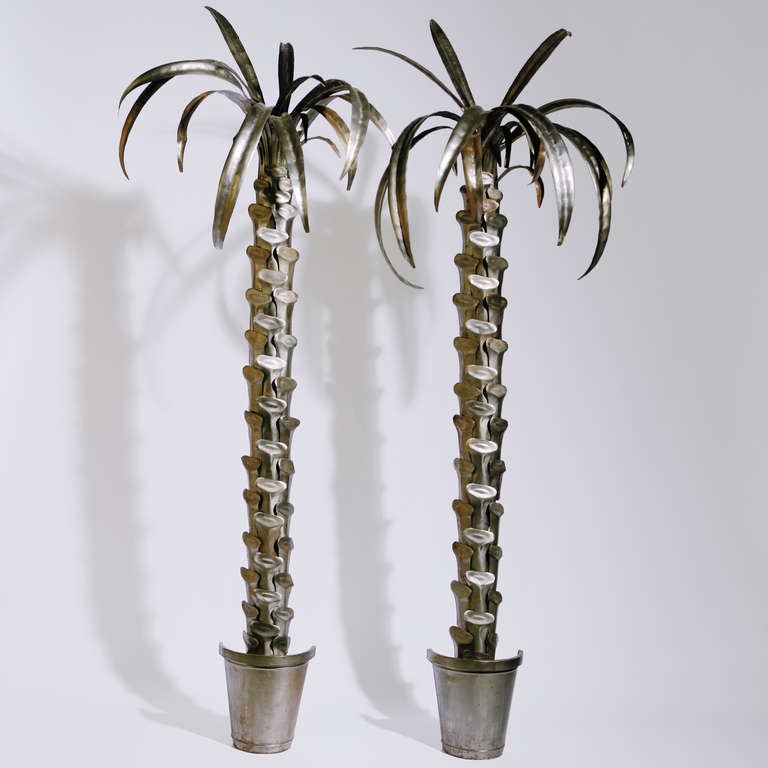 Pair of vintage silvered grey potted palm trees in polished metal formed in a demilune shape for wall mounting.