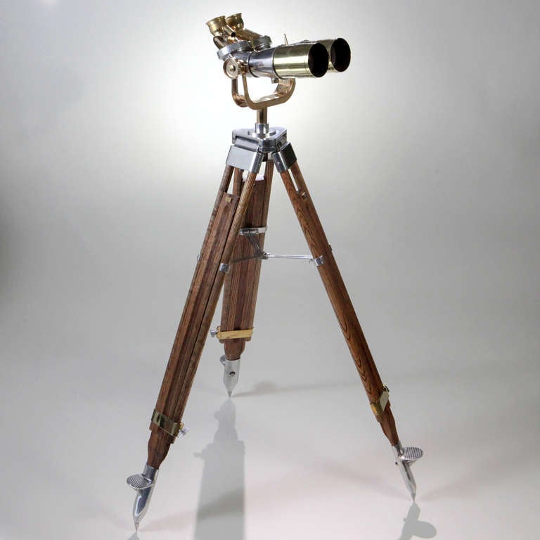 Large standing World War II polished steel Japanese lookout binoculars on adjustable wood tripod stand.  These binoculars are works of art in polished steel with brass fittings that were engineered to last with original rare optics and protractor