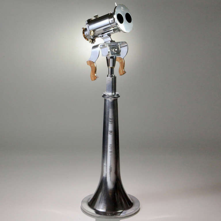 World War II Ross Binoculars on polished metal pedestal. Made by Ross for the British Navy with a 10 x 70 lens. It has filters for different light conditions, so that even with the sun behind an aircraft, you could keep watching it flying toward you