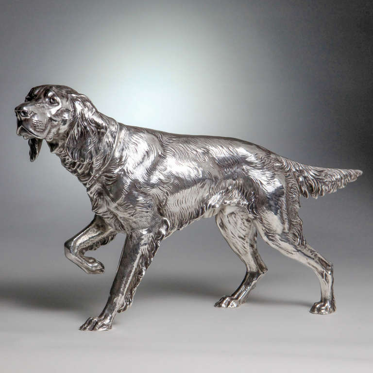 Silver plate Irish setter hunting dog on point, a handsome decorative accessory for your library or study.