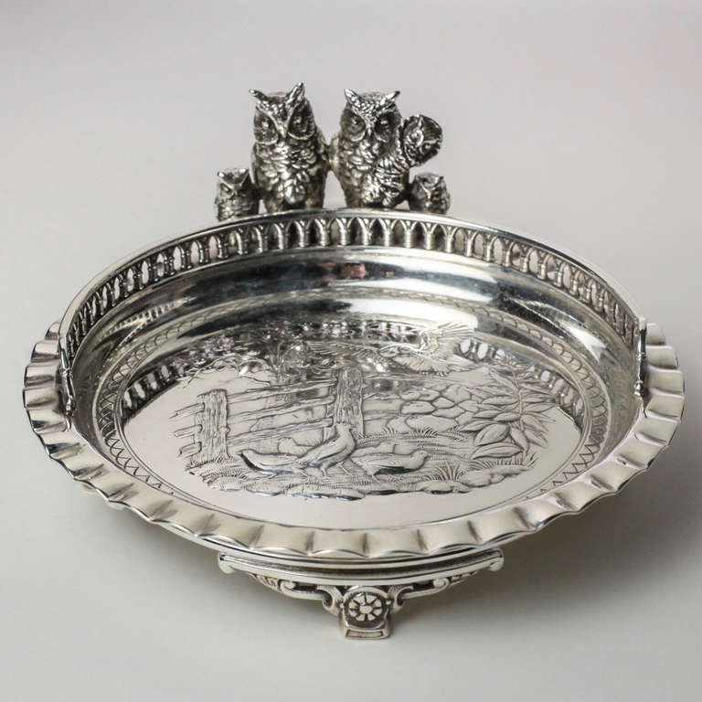 Decorative calling card plate with embossed barnyard theme and pie crust edge. The side with small owl family. Quadruple silver plate. Hallmarks: Simpson, Hall, Miller & Co. 527.