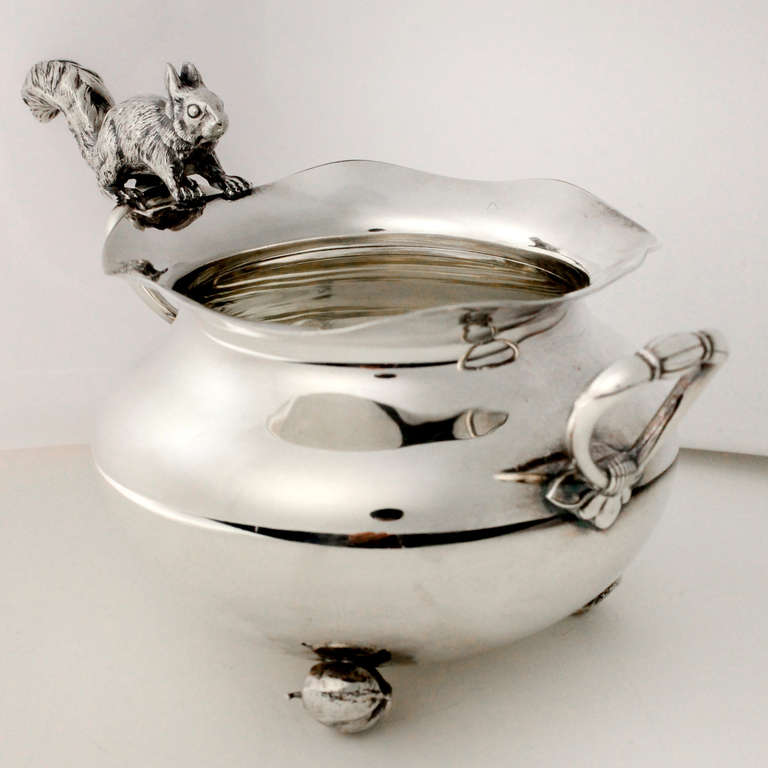 Round silver plate nut dish with scalloped edge and small squirrel perched on side branch. James W. Tufts, Boston, 