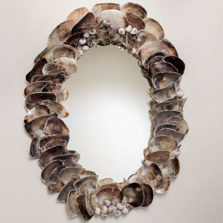 Fantastic one-of-a-kind oval oyster shell mirror. Topped with amazing huge piece of rutilated amethyst (hundreds of karats)!