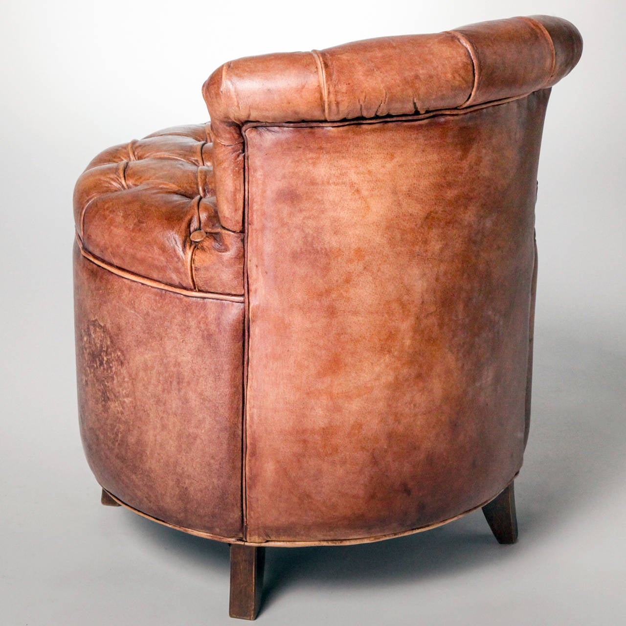 Small handmade tufted brown leather boudoir chair. Greta Garbo style accent chair. Limited edition; only two produced.