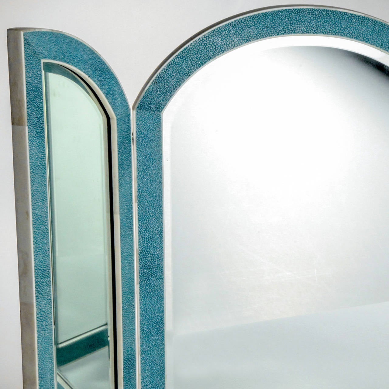 Striking handcrafted tri-fold mirror framed in turquoise shagreen stingray with bone trim. Handmade in France.