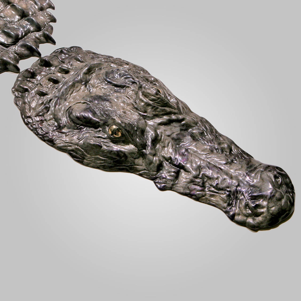 Limited edition large cast bronze crocodile sculpture with hand-patinated finish.  This unique three-piece art object, signed and dated by the artist, can be displayed on a table or on the floor.  Smaller size also available.