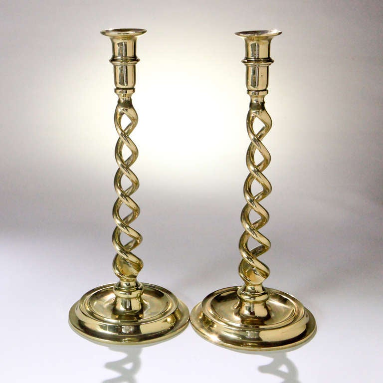 Pair of 19th Century English brass candlesticks in traditional barley twist design.