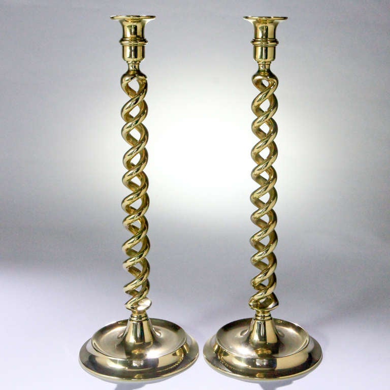 Striking pair of 19th Century English brass candlesticks in traditional barley-twist design.
