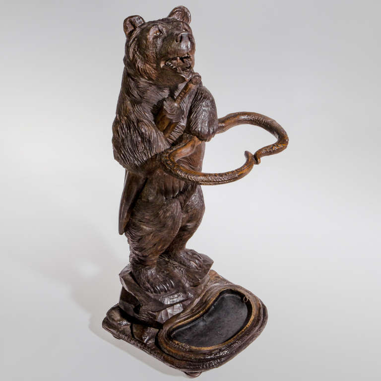 Exceptional large size Black Forest carved wood umbrella stand. A whimsical design with the 
