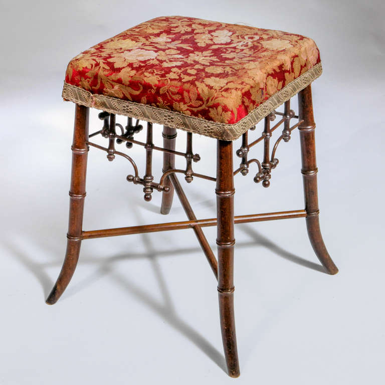 Small English bamboo stool with vintage brocade fabric top.