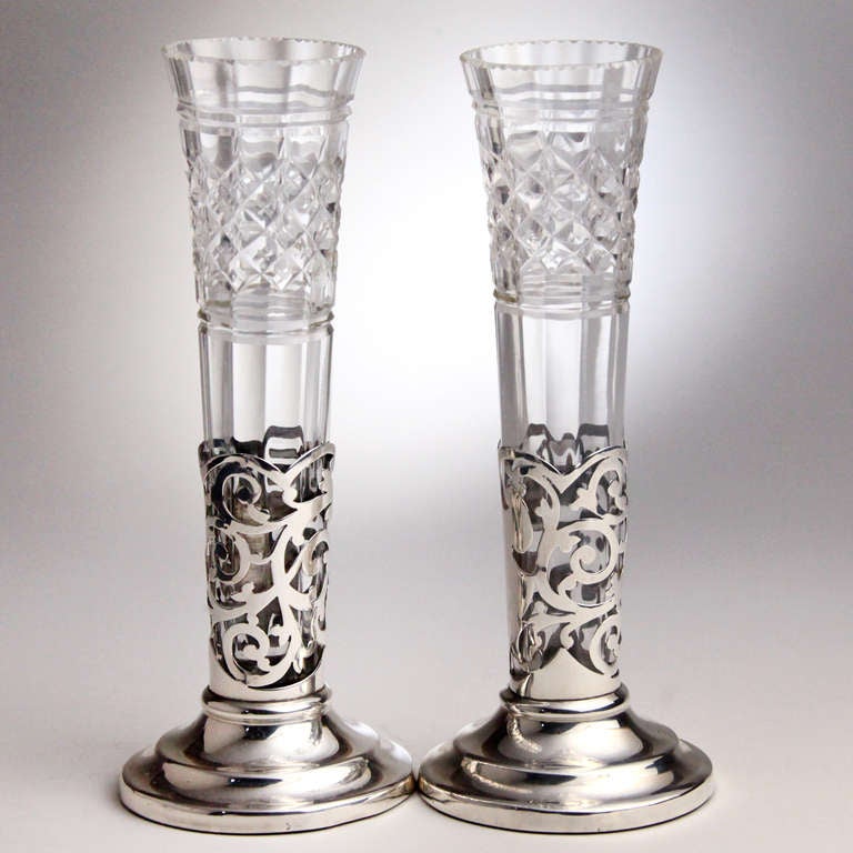 Exquisite matched pair of Edwardian hallmarked pierced silver vases with cut crystal inserts. Hallmark: William Davenport, Birmingham, England, 1904-05.