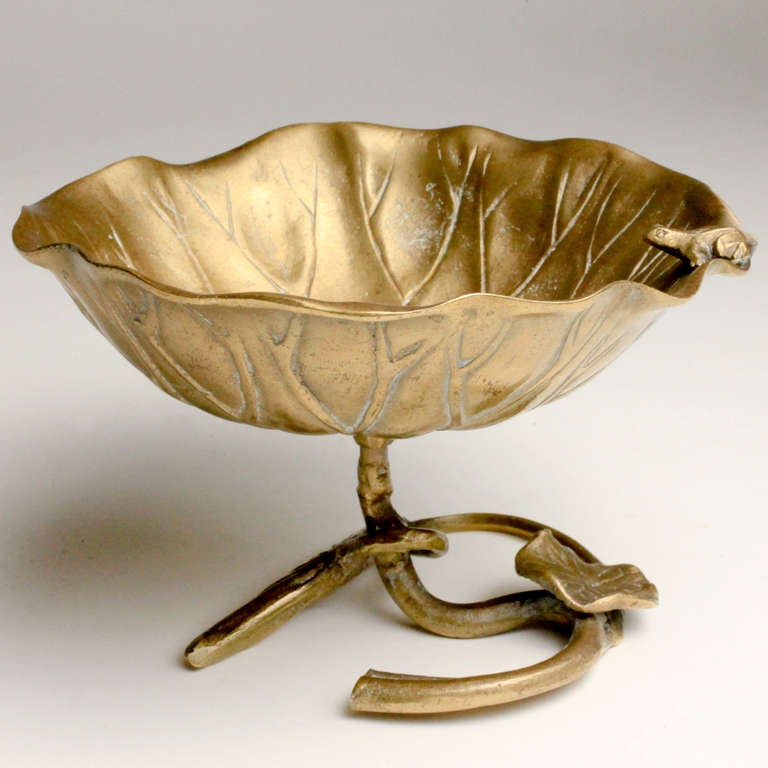 Decorative small English brass vide poche uniquely shaped as a lily pond flower with the vine and leaf of the flower forming the raised base. A small frog charmingly rests on the rim. French for 