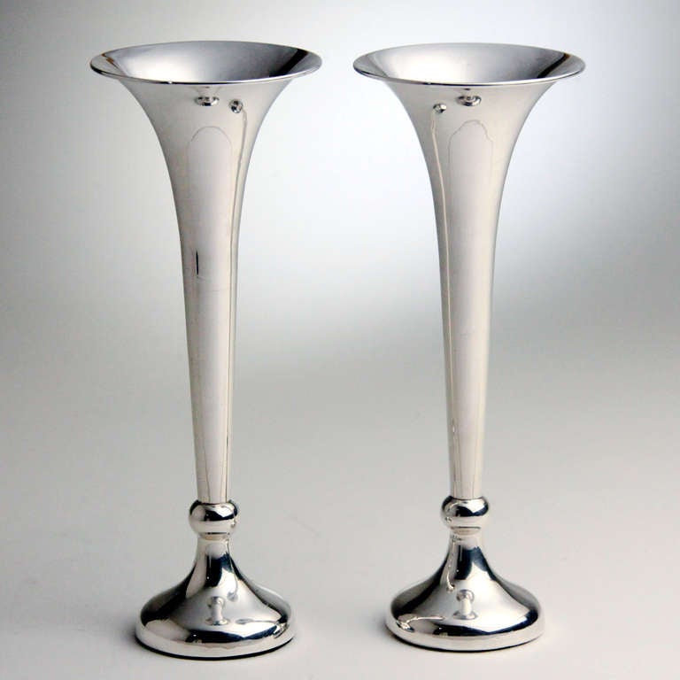 Classic pair of perfectly matched sterling silver English trumpet vases. Hallmarked: Napper & Davenport, Birmingham, England, 1919-1920.