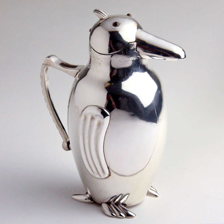 Classic vintage silverplate Art Deco penguin pitcher.  Excellent detail with ribbed pattern repeated on feet, wings, top plume and handle.