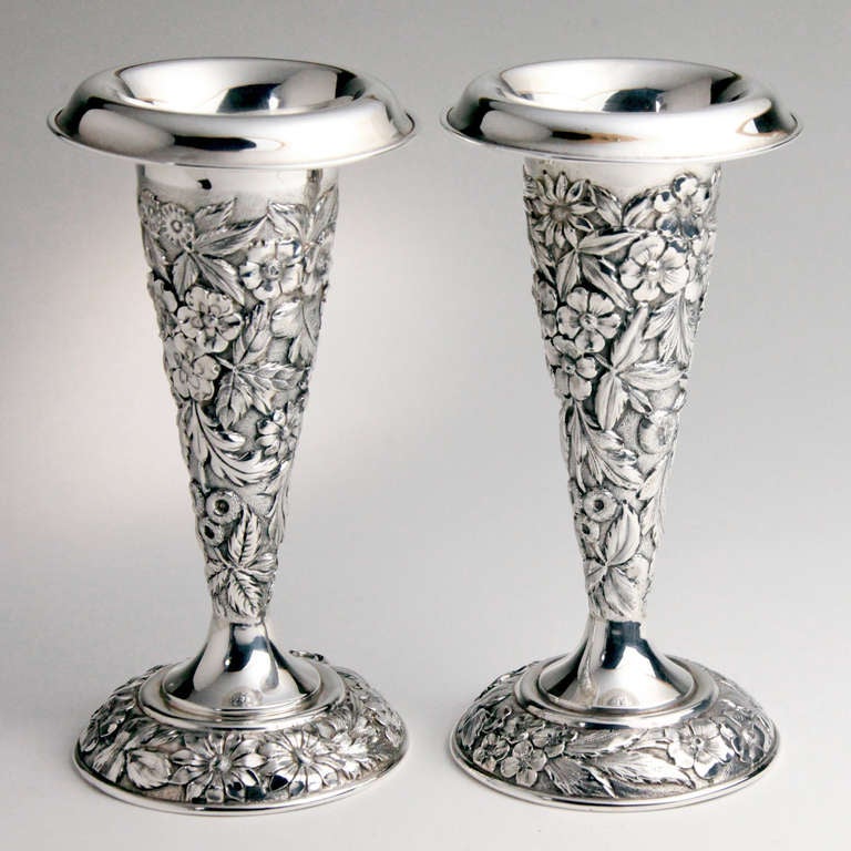 Pair of sterling silver repousse vases in a floral and leaf pattern by Jenkins & Jenkins. Hallmarked: Jenkins & Jenkins Inc, makers fine sterling, Baltimore, 324.