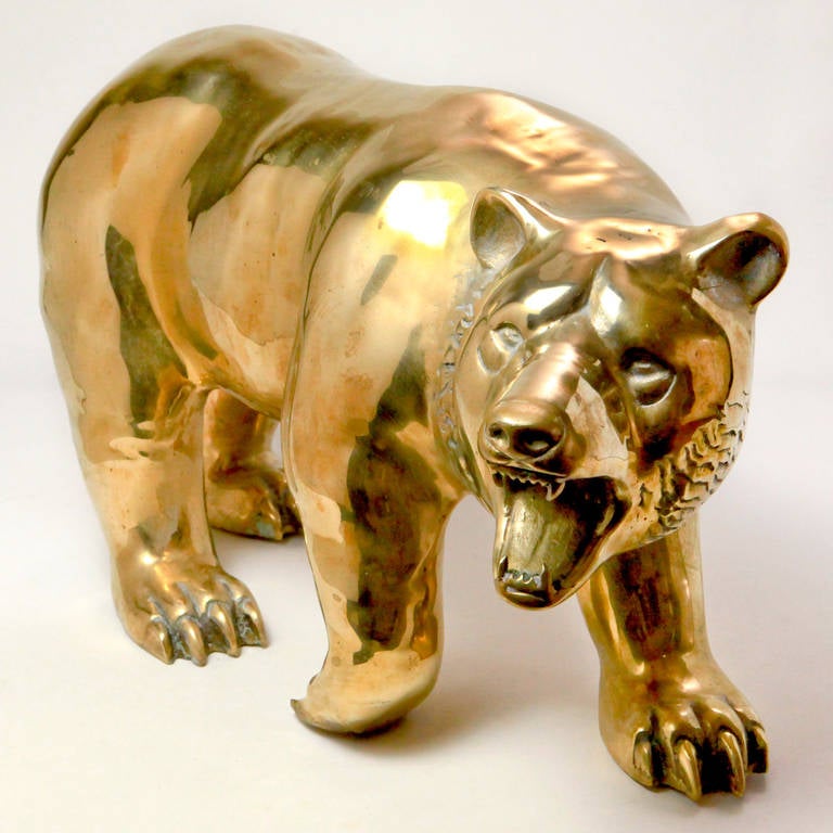 Life-like large brass bear figure. Realistically cast with fluid walking movement. Excellent detail on face and paws.