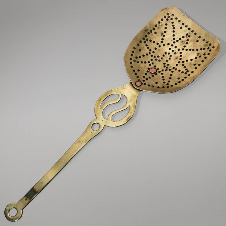 19th century English brass skimmer tool used to remove the solids from the broth. Designed with pierced star pattern.