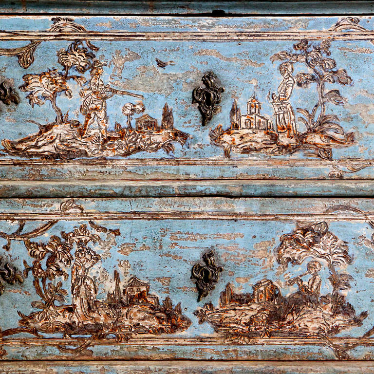 Remarkable 18th century Italian painted commode with excellent detailing. Skillfully painted Queen Anne style chest of drawers with pastoral scenes painted on a grotto blue background.