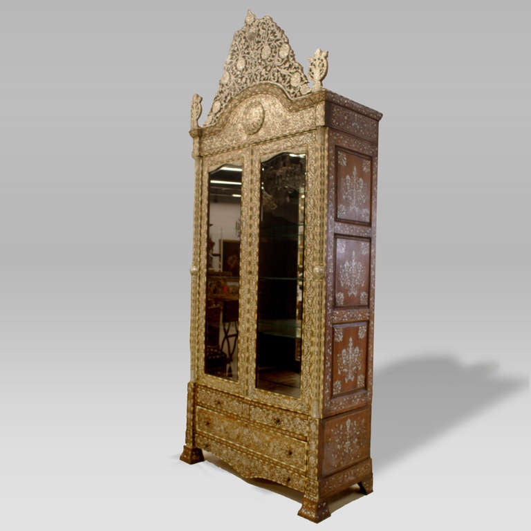 Important Ottoman Empire fruitwood cabinet intricately inlaid with camel bone and mother-of-pearl. Ornamental detailed design with 