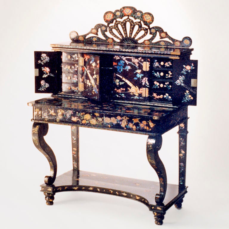 Exquisitely detailed 19th Century Nagasaki technique lacquer work dressing table. The whole extensively inlaid with birds and flowers using colored mother of pearl and abalone on a white gold ground.  The top cabinet with hinged doors that open to