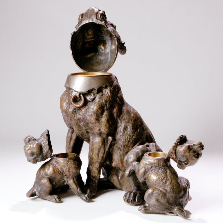 Victorian bronze humidor dog group designed as an old fashioned mother bulldog with her two pups. Each dog with a hinged head that opens to reveal a storage compartment for tobacco or matches.