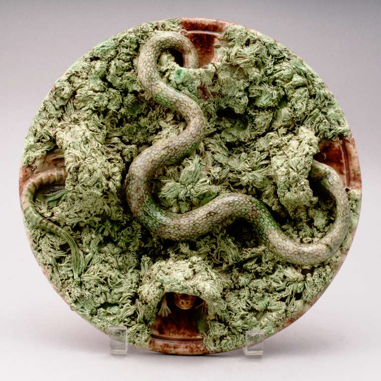 19th century Portuguese Palissy plate with large snake searching through mossy tuft. Frog and lizard hiding in other mossy caves. Crown mark, Mafra, Caldas.