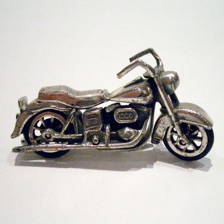 Scale model of a Harley-Davidson motorcycle in a silver finish. Harley model #1200 with excellent detailing including license plate "EH 80".
