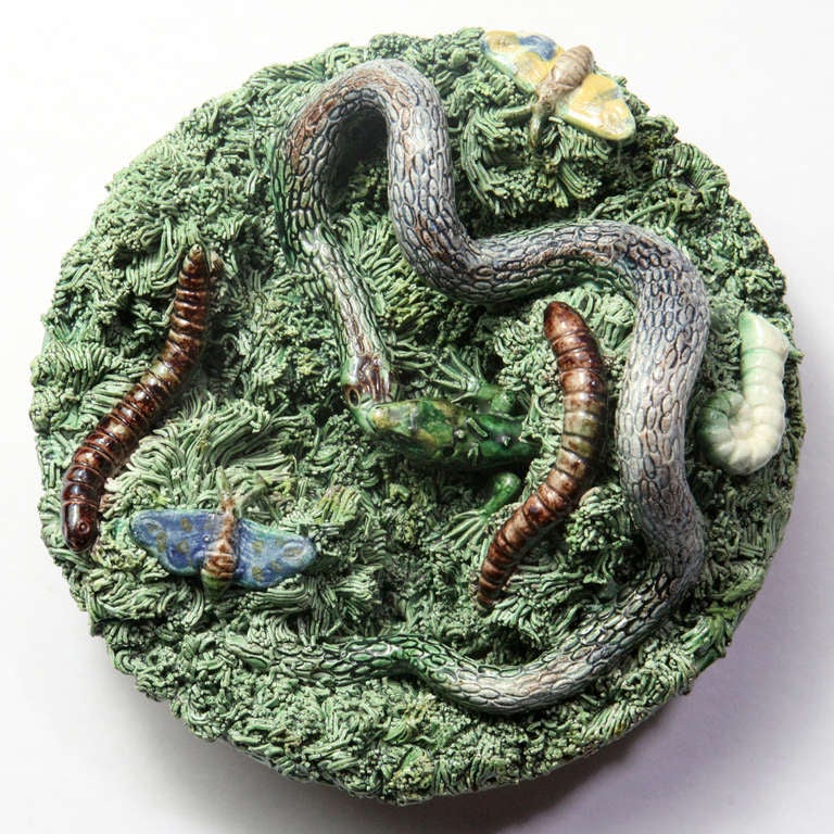 Small Portuguese Palissy plate or charger with green grasses, coiled snake and moths. Signed: Jose A. Cunha, Caldas, Rainha, Portugal.