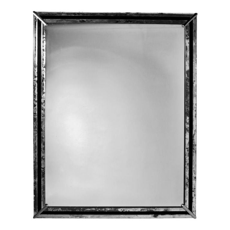Large Art Deco 1920s wall mirror.  Narrow frame is beveled antique mirror with black mirror center border.  Mirror is banded on all four corners with nickel decorative strips.