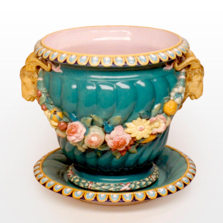 Majolica jardinière in rare green color with spiral fluted body, garlands of fruit and flowers, ram's head handles. Minton Renaissance piece like this one was shown at the Great Exhibition in 1851, modelled by Baron Carlo Marochetti. Known pattern