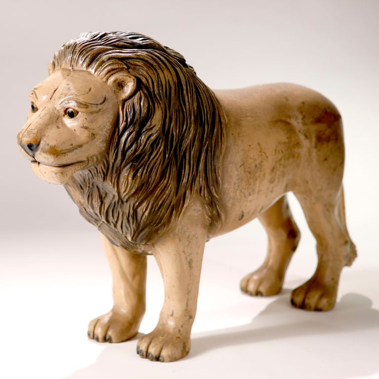 A rare early turn-of-the-century English nursery toy. A standing lion with warm smiling face and excellent detail. In hard molded rubber with the original 