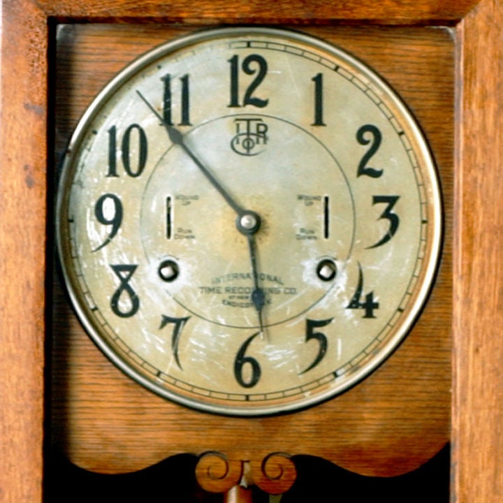 antique time recording clock